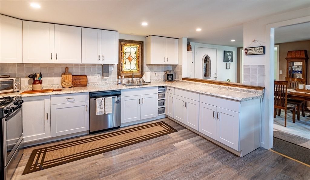 Dining room, Interior, Kitchen, Recessed Lighting, Stainless Steel Appliances, Wood Texture Flooring
