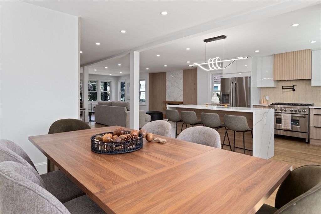 Dining room, Interior, Kitchen, Marble Walls, Pendant Lights, Recessed Lighting, Stainless Steel Appliances, Wood Texture Flooring