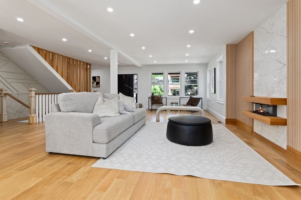 Fireplace, Interior, Living room, Marble Walls, Recessed Lighting, Wood Texture Flooring