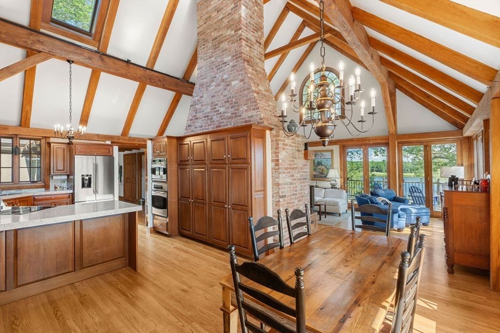 Chandelier, Dining room, Interior, Kitchen, Living room, Stainless Steel Appliances, Stone Walls, Wooden Beams, Wood Texture Flooring