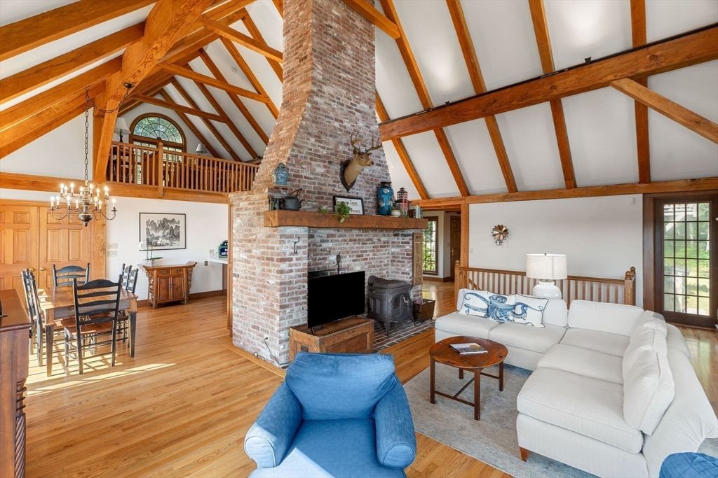 Chandelier, Dining room, Fireplace, Interior, Living room, Stone Walls, Wooden Beams, Wood Texture Flooring