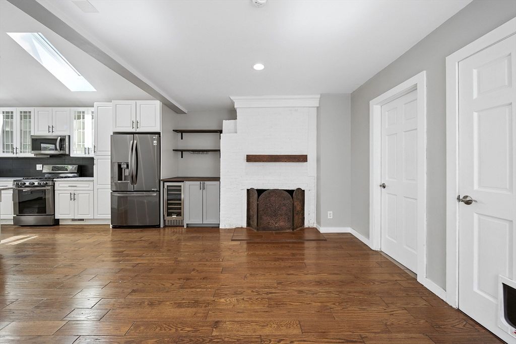 Fireplace, Interior, Kitchen, Recessed Lighting, Stainless Steel Appliances, Wood Texture Flooring