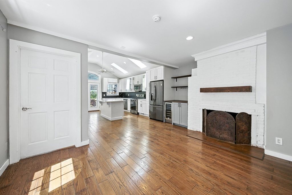Fireplace, Interior, Kitchen, Recessed Lighting, Stainless Steel Appliances, Wood Texture Flooring
