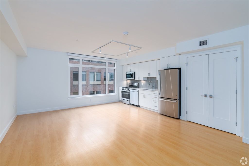 Empty room, Interior, Kitchen, Pendant Lights, Stainless Steel Appliances, Wood Texture Flooring