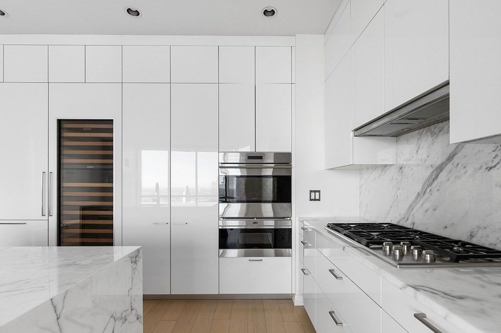 Interior, Kitchen, Marble Walls, Recessed Lighting, Stainless Steel Appliances, Wood Texture Flooring