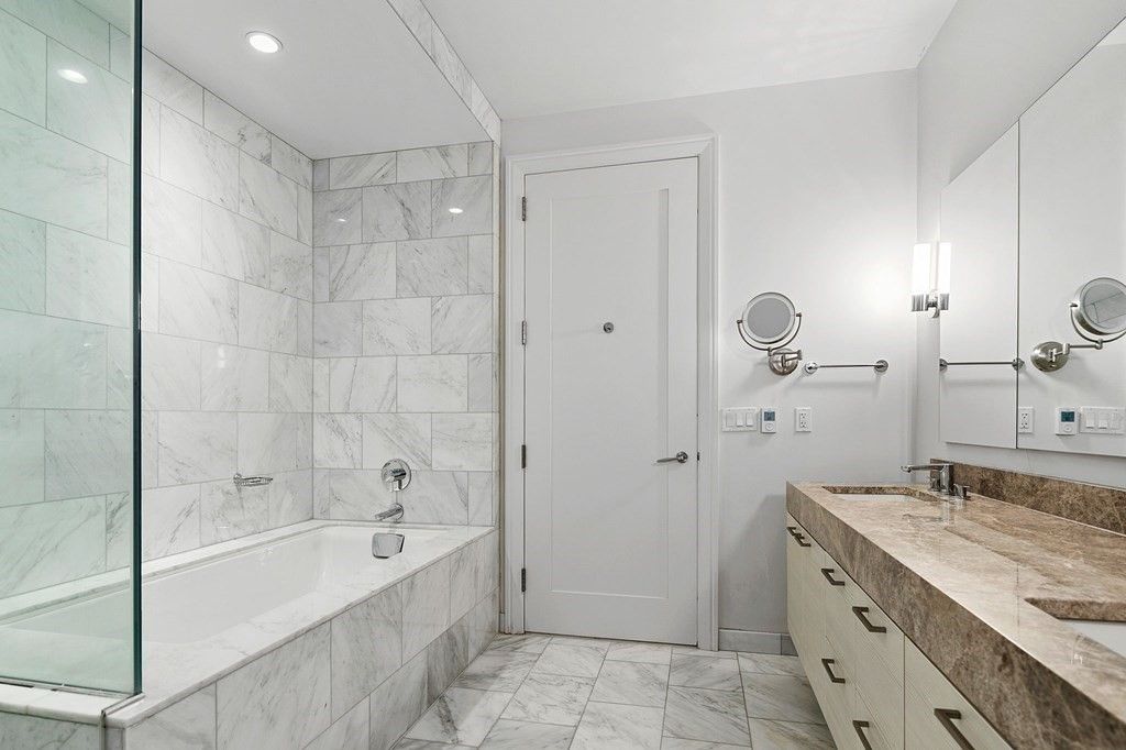 Bathroom, Dual Sink Vanities, Glass Shower, Interior, Marble, Marble Walls, Recessed Lighting