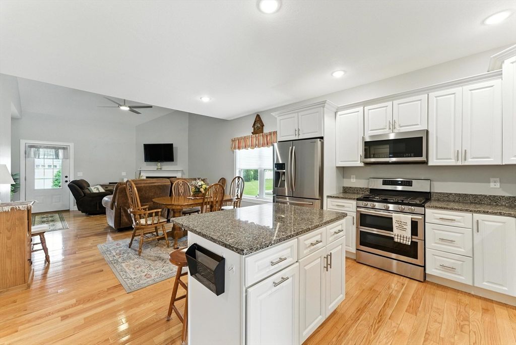 Dining room, Interior, Kitchen, Living room, Recessed Lighting, Stainless Steel Appliances, Wood Texture Flooring