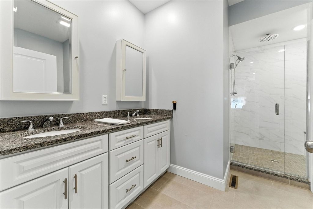 Bathroom, Dual Sink Vanities, Glass Shower, Interior, Marble Walls, Recessed Lighting