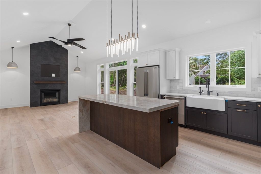Fireplace, Interior, Kitchen, Pendant Lights, Recessed Lighting, Stainless Steel Appliances, Wood Texture Flooring