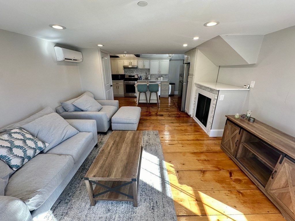 Fireplace, Interior, Kitchen, Living room, Recessed Lighting, Stainless Steel Appliances, Wood Texture Flooring