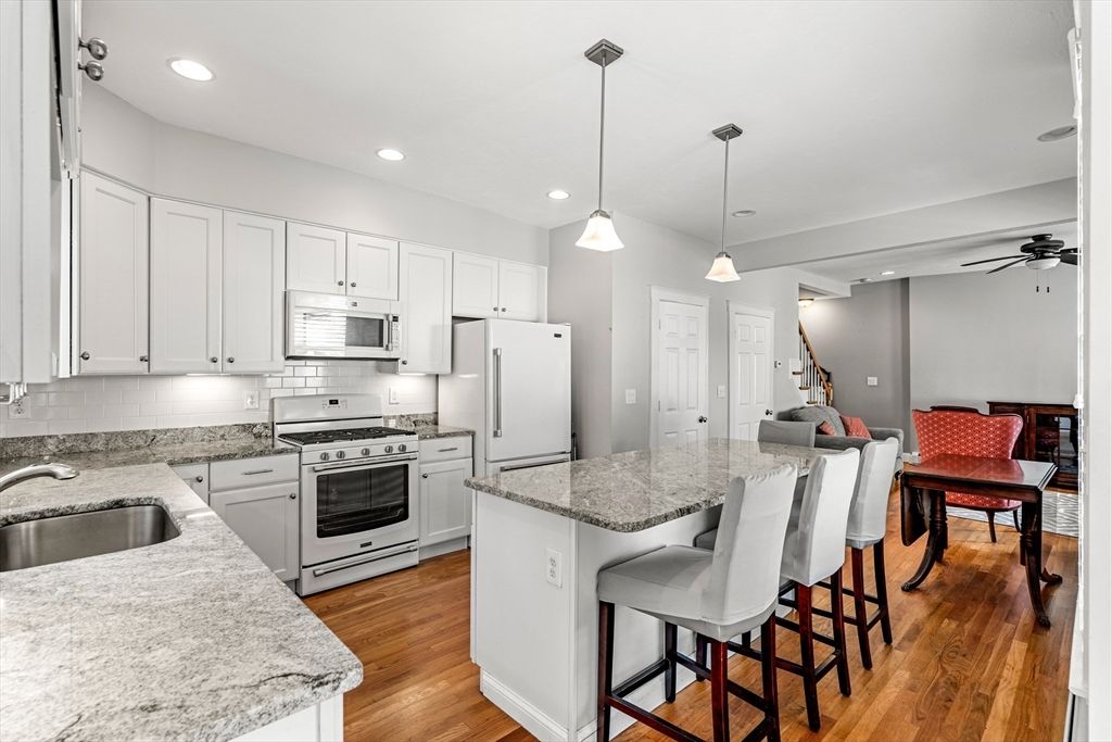 Dining room, Interior, Kitchen, Pendant Lights, Recessed Lighting, Stainless Steel Appliances, Wood Texture Flooring