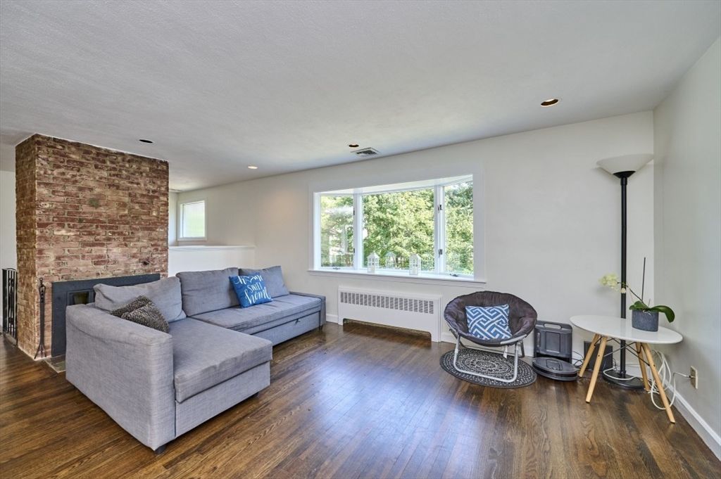 Fireplace, Interior, Living room, Recessed Lighting, Stone Walls, Wood Texture Flooring