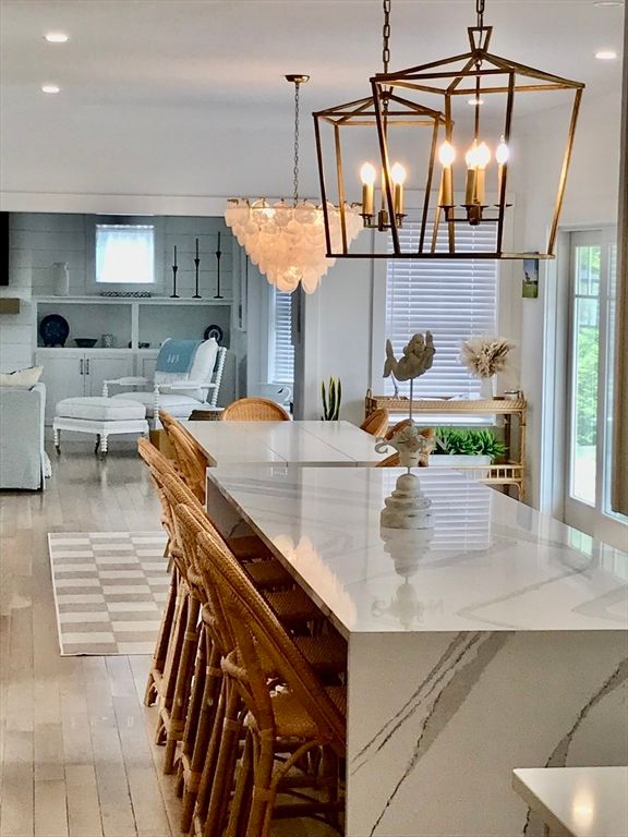 Chandelier, Dining room, Fireplace, Interior, Living room, Pendant Lights, Recessed Lighting, Wood Texture Flooring