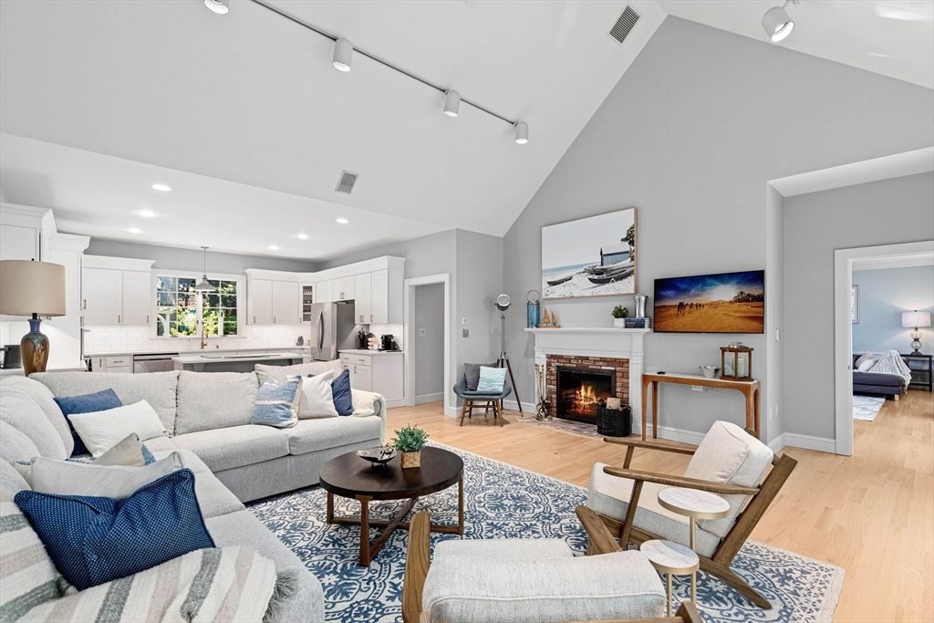 Fireplace, Interior, Kitchen, Living room, Pendant Lights, Recessed Lighting, Stainless Steel Appliances, Wood Texture Flooring