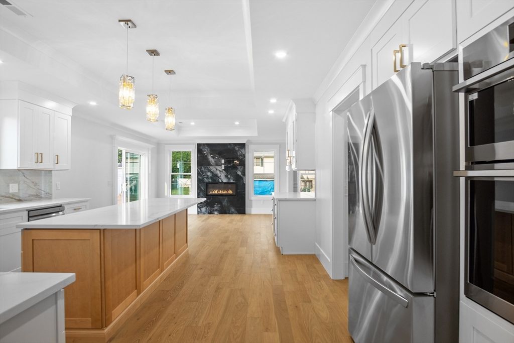 Fireplace, Interior, Kitchen, Pendant Lights, Recessed Lighting, Stainless Steel Appliances, Wood Texture Flooring
