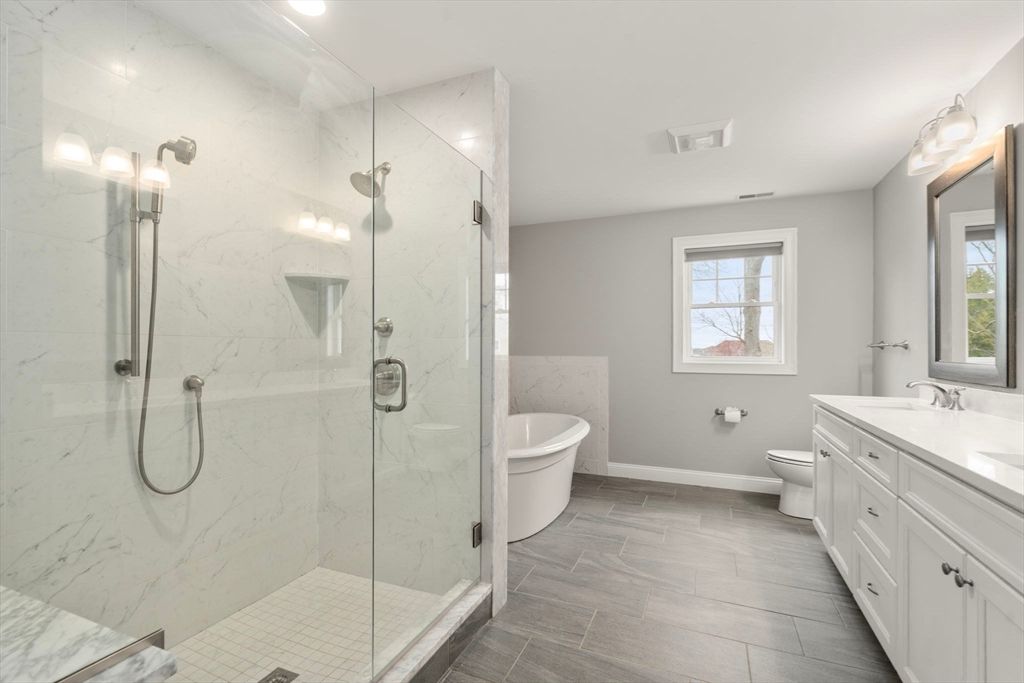 Bathroom, Dual Sink Vanities, Glass Shower, Interior, Marble Walls, Recessed Lighting