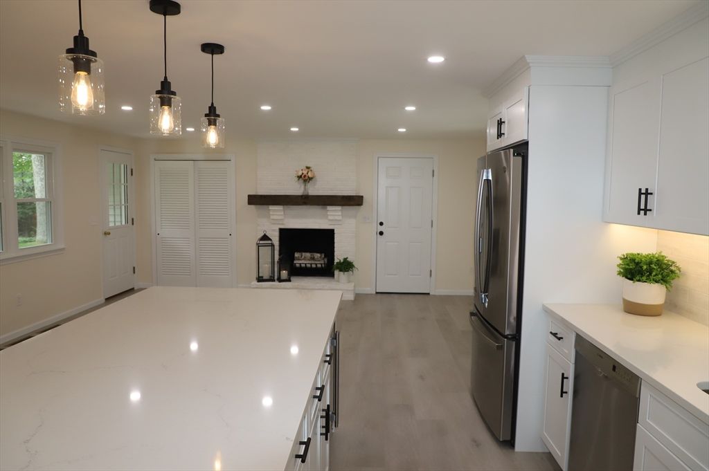 Fireplace, Interior, Kitchen, Pendant Lights, Recessed Lighting, Stainless Steel Appliances, Wood Texture Flooring
