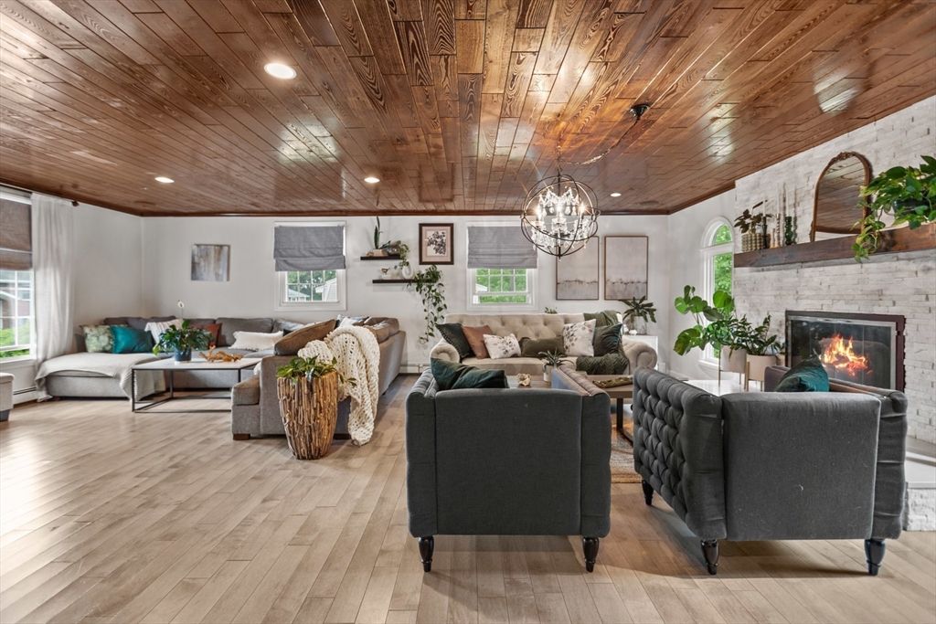Chandelier, Dining room, Fireplace, Interior, Living room, Recessed Lighting, Wooden Ceilings, Wood Texture Flooring