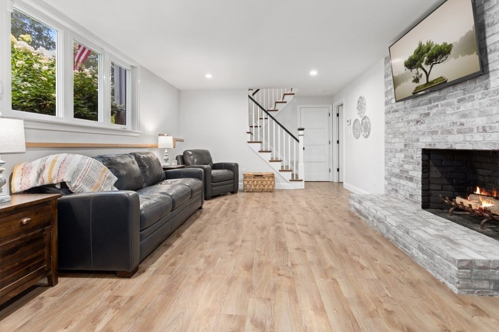 Fireplace, Interior, Living room, Recessed Lighting, Stone Walls, Wood Texture Flooring