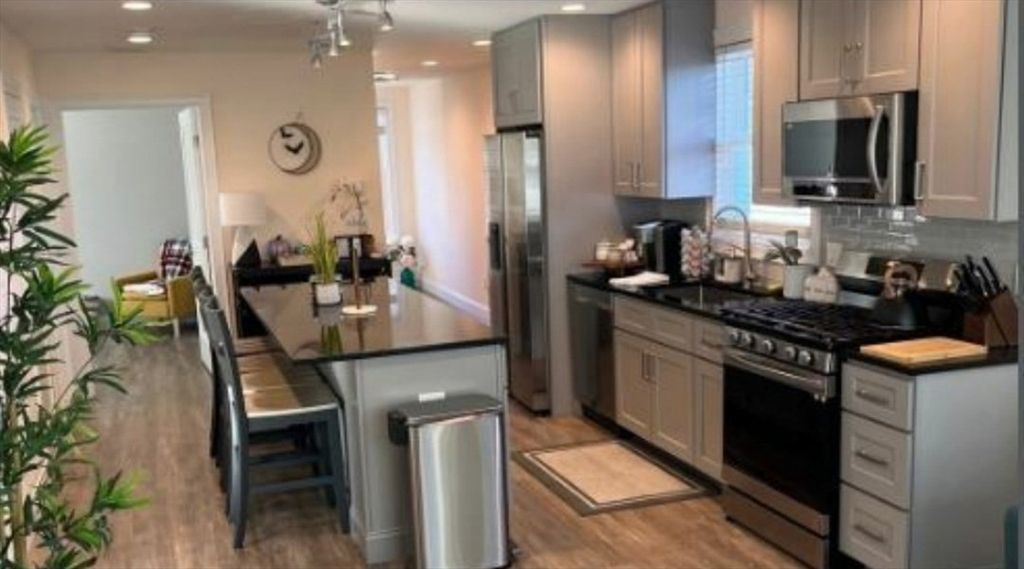 Dining room, Interior, Kitchen, Recessed Lighting, Stainless Steel Appliances, Wood Texture Flooring