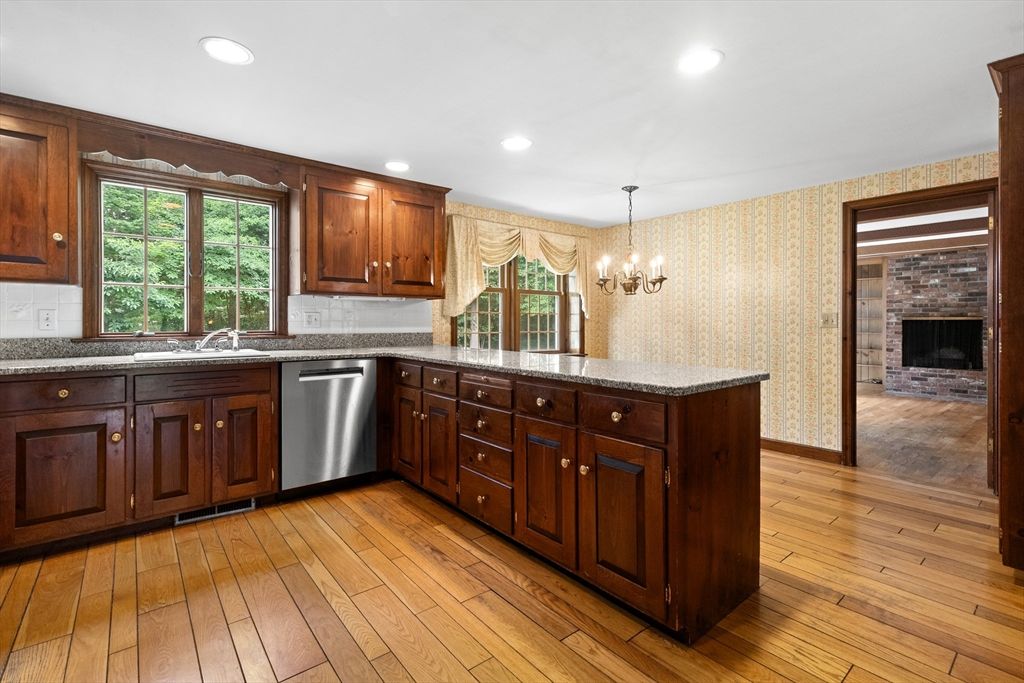 Chandelier, Fireplace, Interior, Kitchen, Recessed Lighting, Stone Walls, Wood Texture Flooring