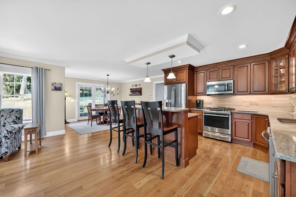 Chandelier, Dining room, Interior, Kitchen, Pendant Lights, Recessed Lighting, Stainless Steel Appliances, Wood Texture Flooring