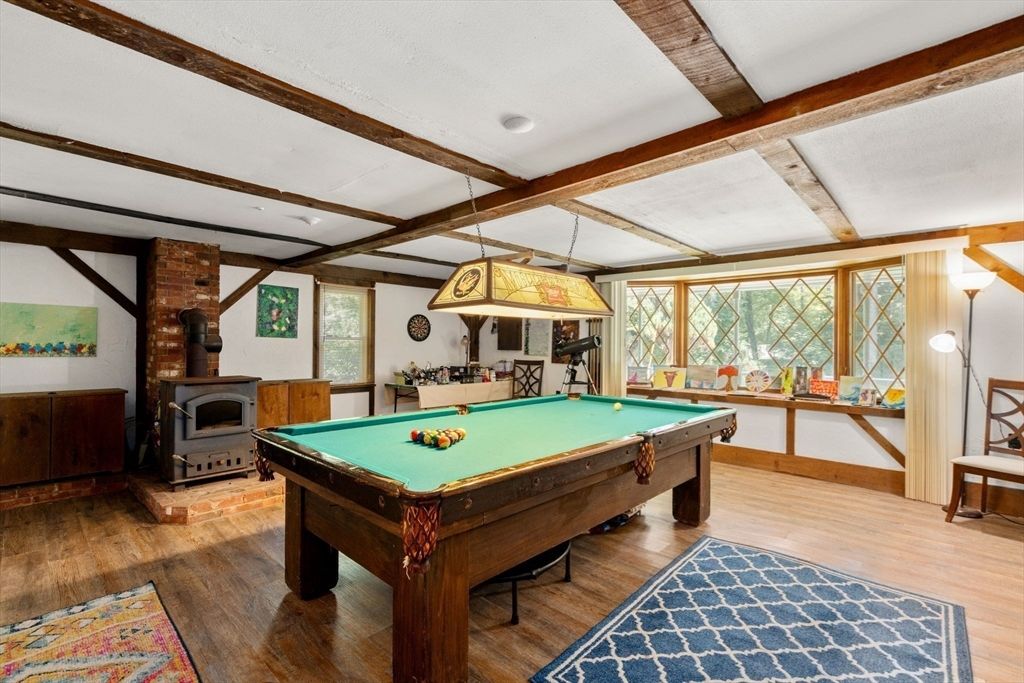 Billiard Table, Fireplace, Game Room, Interior, Pendant Lights, Stone Walls, Wooden Beams, Wood Texture Flooring