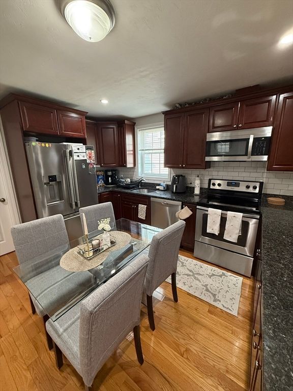 Dining room, Interior, Kitchen, Recessed Lighting, Stainless Steel Appliances, Wood Texture Flooring