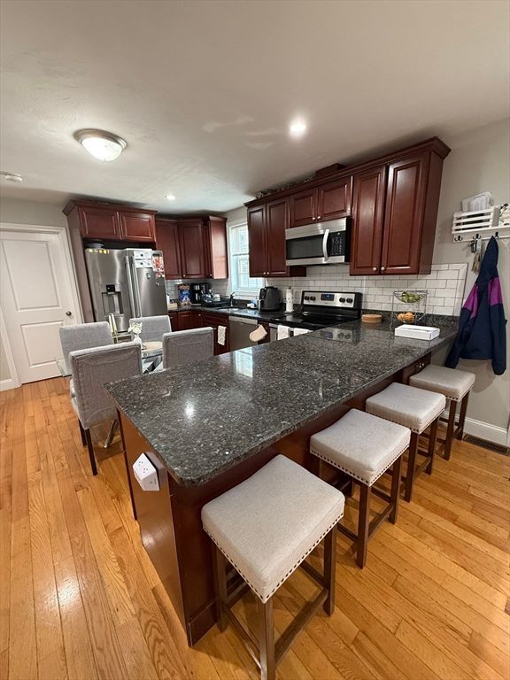 Dining room, Interior, Kitchen, Recessed Lighting, Stainless Steel Appliances, Wood Texture Flooring