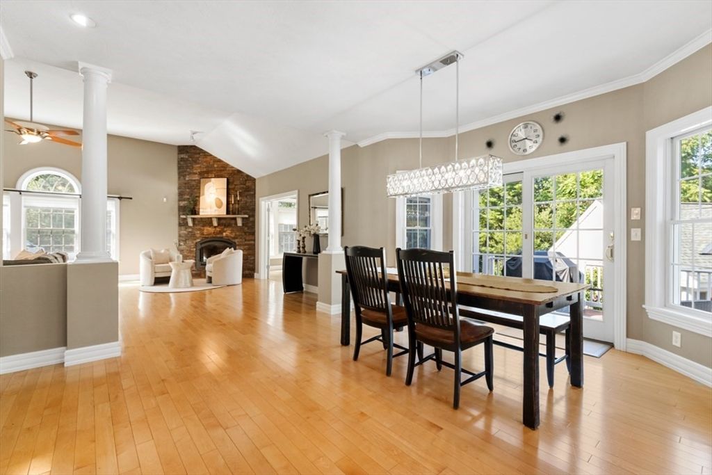 Chandelier, Dining room, Fireplace, Interior, Living room, Pendant Lights, Recessed Lighting, Stone Walls, Wood Texture Flooring