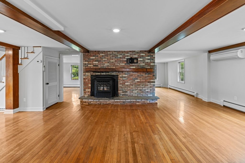 Empty room, Fireplace, Interior, Recessed Lighting, Stone Walls, Wood Texture Flooring