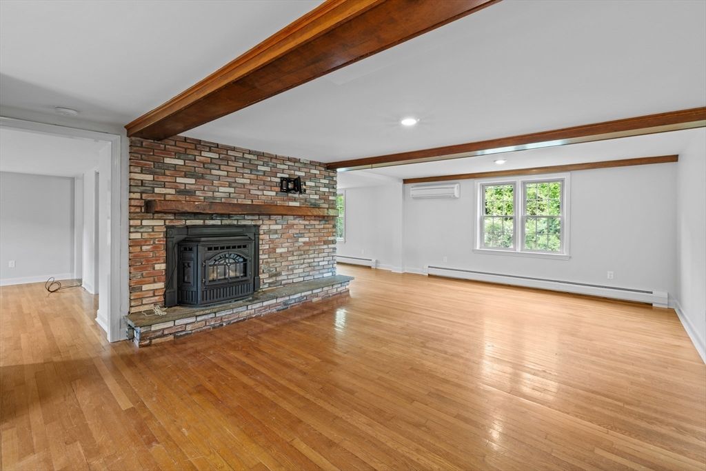 Empty room, Fireplace, Interior, Recessed Lighting, Stone Walls, Wooden Beams, Wood Texture Flooring