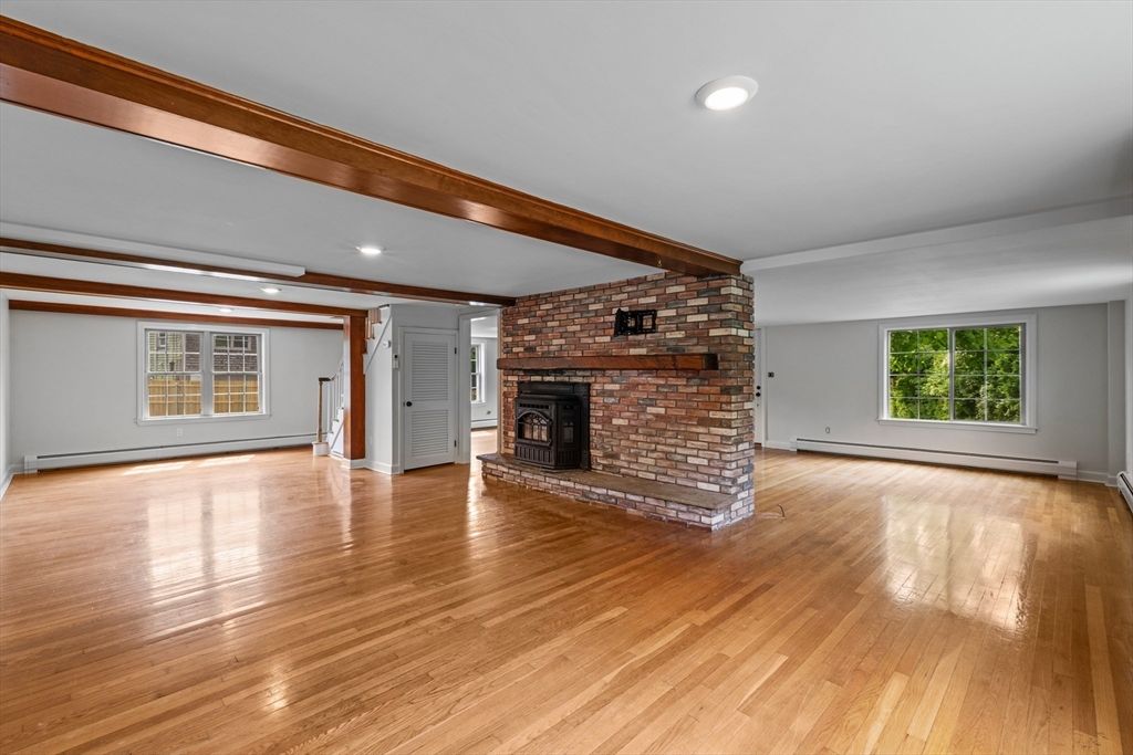 Empty room, Fireplace, Interior, Recessed Lighting, Stone Walls, Wooden Beams, Wood Texture Flooring
