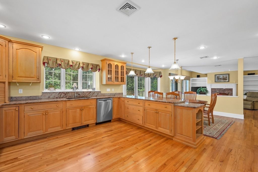 Dining room, Fireplace, Interior, Kitchen, Pendant Lights, Recessed Lighting, Stainless Steel Appliances, Wood Texture Flooring