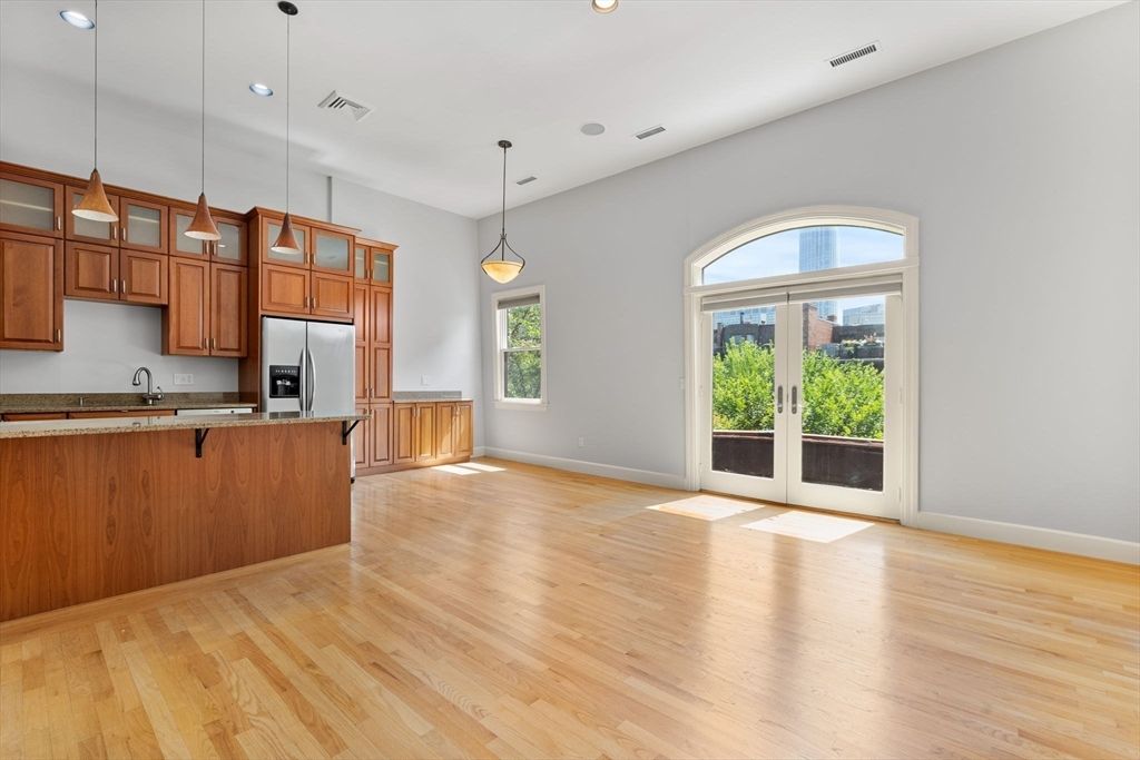 Empty room, Interior, Kitchen, Pendant Lights, Recessed Lighting, Stainless Steel Appliances, Wood Texture Flooring