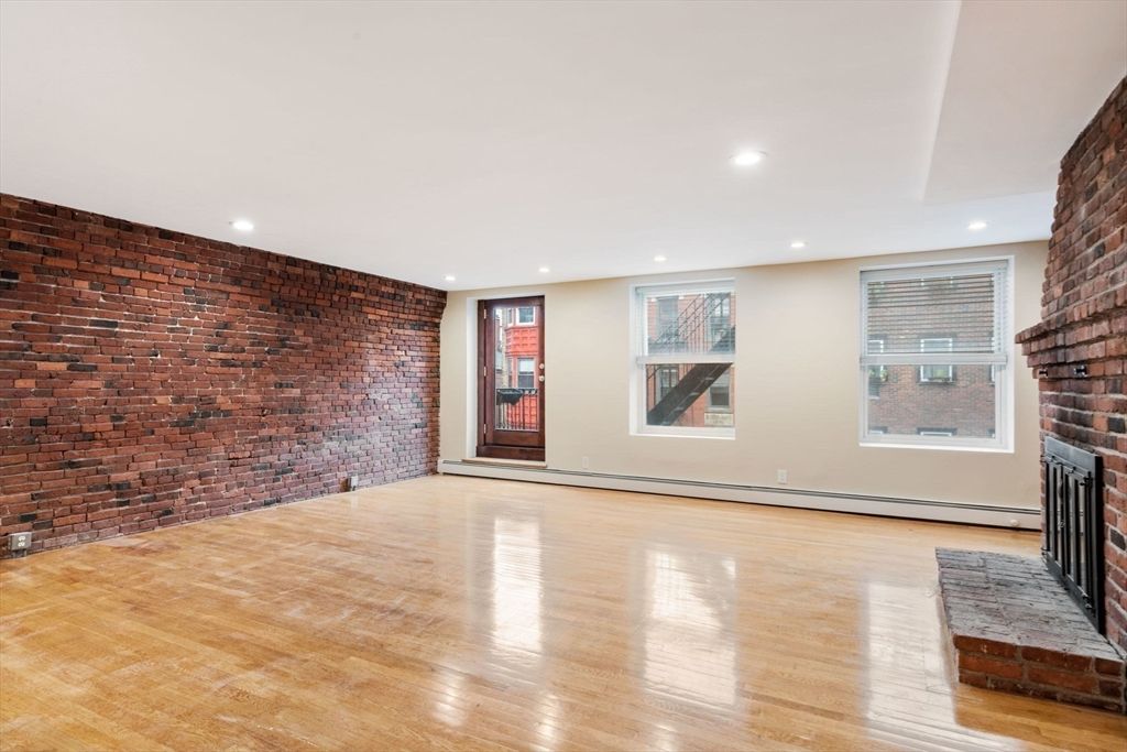 Empty room, Fireplace, Interior, Recessed Lighting, Stone Walls, Wood Texture Flooring