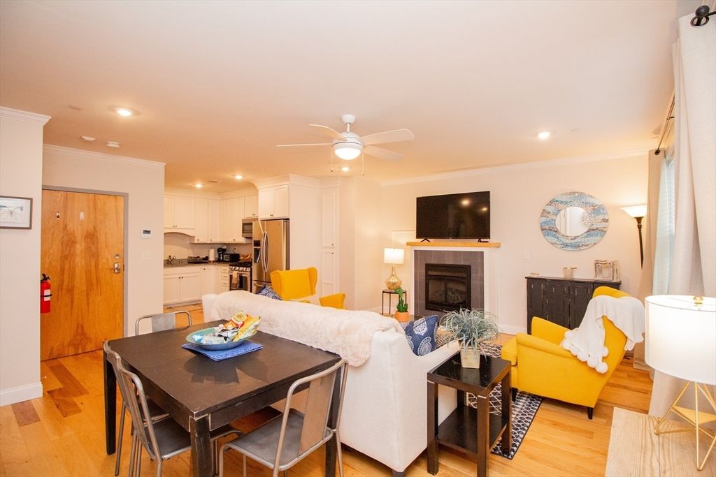 Dining room, Fireplace, Interior, Kitchen, Living room, Recessed Lighting, Stainless Steel Appliances, Wood Texture Flooring