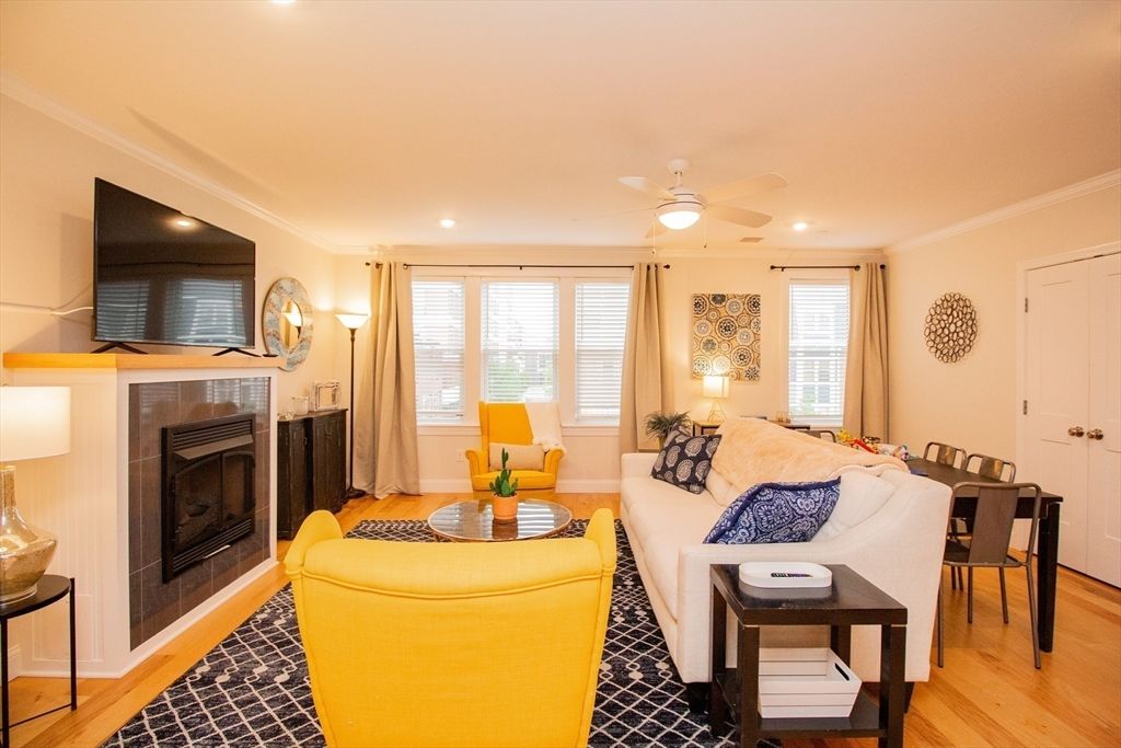 Dining room, Fireplace, Interior, Living room, Recessed Lighting, Wood Texture Flooring