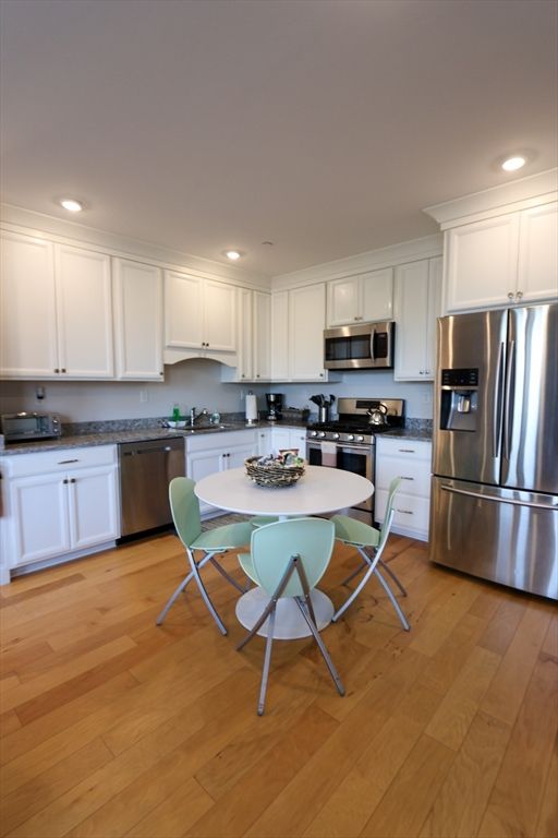 Dining room, Interior, Kitchen, Recessed Lighting, Stainless Steel Appliances, Wood Texture Flooring