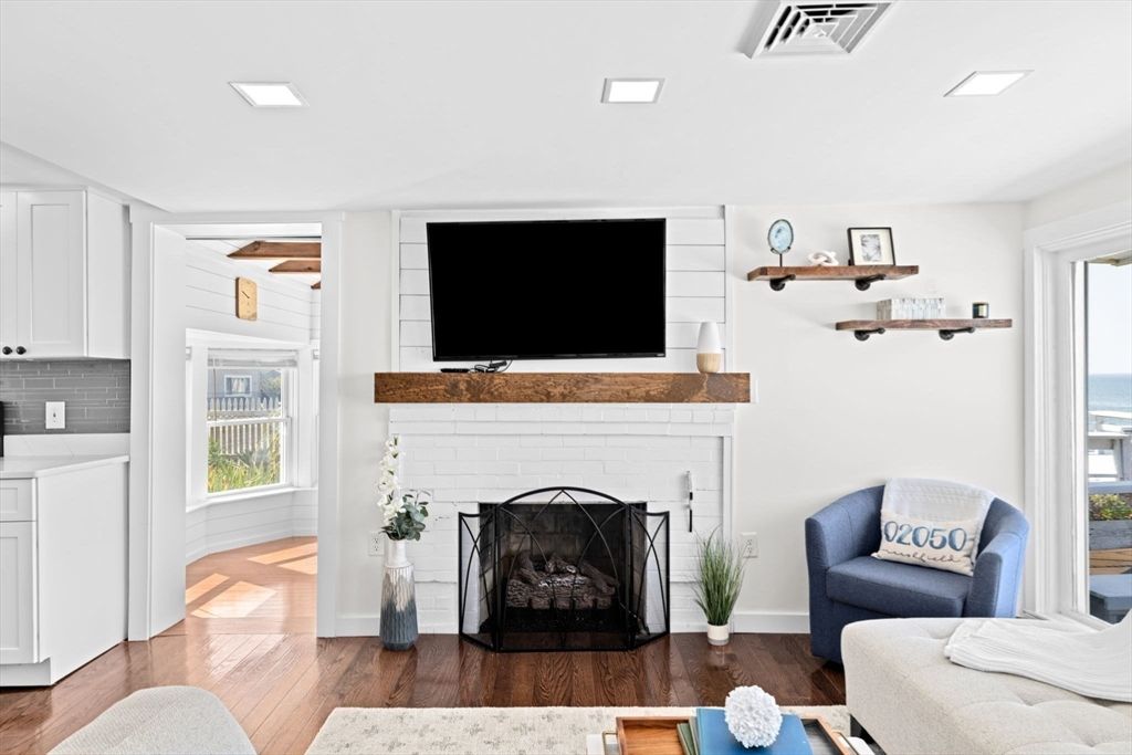 Fireplace, Interior, Living room, Recessed Lighting, Water, Wood Texture Flooring