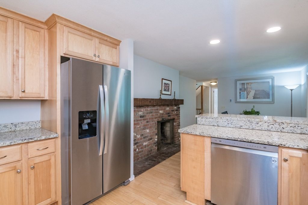 Fireplace, Interior, Kitchen, Recessed Lighting, Stainless Steel Appliances, Stone Walls, Wood Texture Flooring