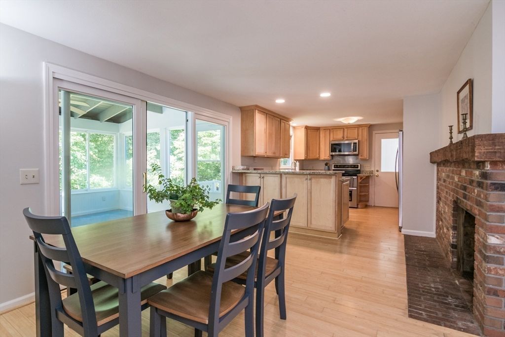 Dining room, Fireplace, Interior, Kitchen, Recessed Lighting, Stainless Steel Appliances, Wood Texture Flooring