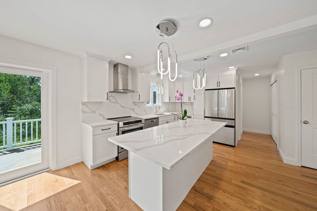 Interior, Kitchen, Marble Walls, Pendant Lights, Recessed Lighting, Stainless Steel Appliances, Wood Texture Flooring