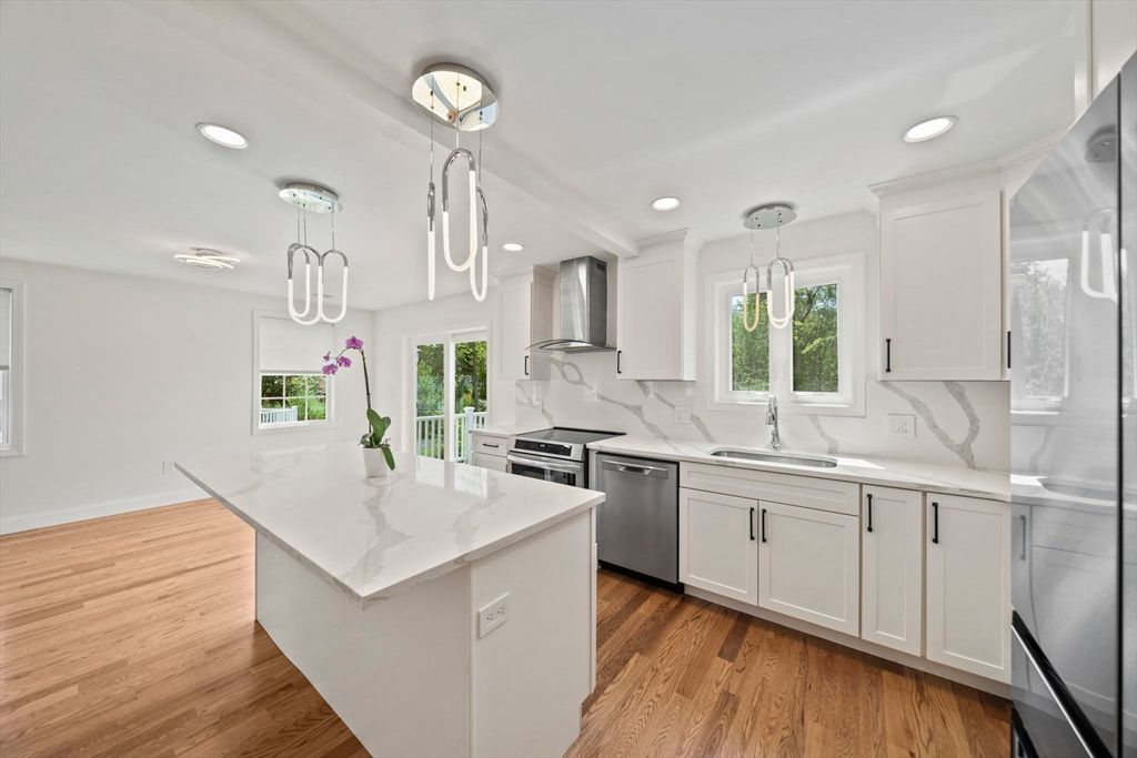 Interior, Kitchen, Marble Walls, Pendant Lights, Recessed Lighting, Stainless Steel Appliances, Wood Texture Flooring