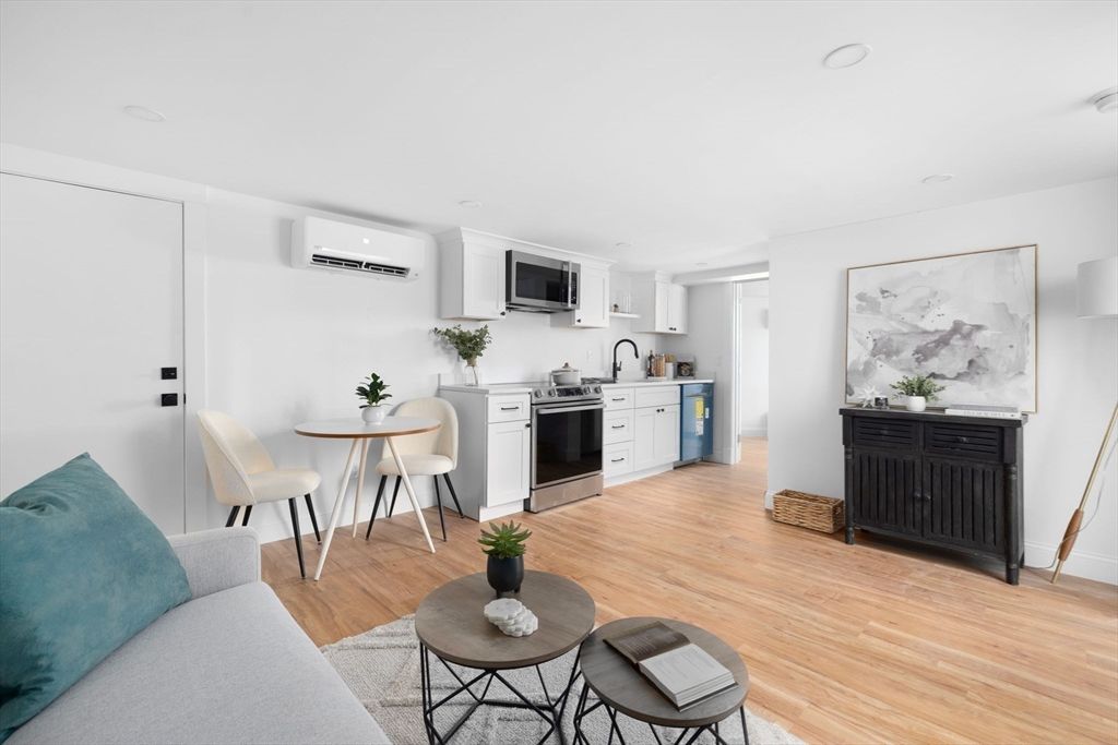 Dining room, Interior, Kitchen, Living room, Recessed Lighting, Stainless Steel Appliances, Wood Texture Flooring