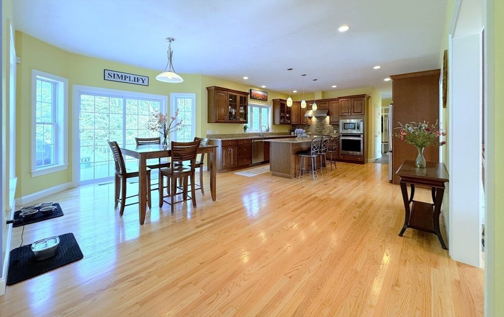 Dining room, Interior, Kitchen, Pendant Lights, Recessed Lighting, Stainless Steel Appliances, Wood Texture Flooring