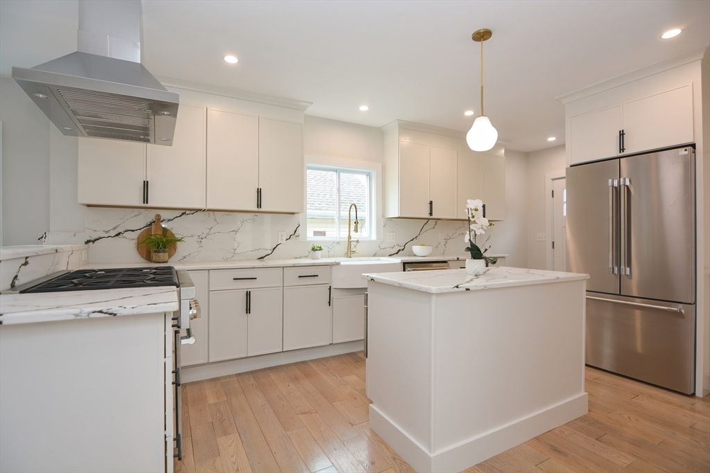 Interior, Kitchen, Marble Walls, Pendant Lights, Recessed Lighting, Stainless Steel Appliances, Wood Texture Flooring