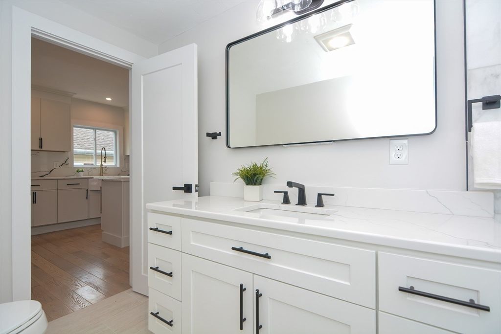Bathroom, Dual Sink Vanities, Interior, Recessed Lighting, Wood Texture Flooring