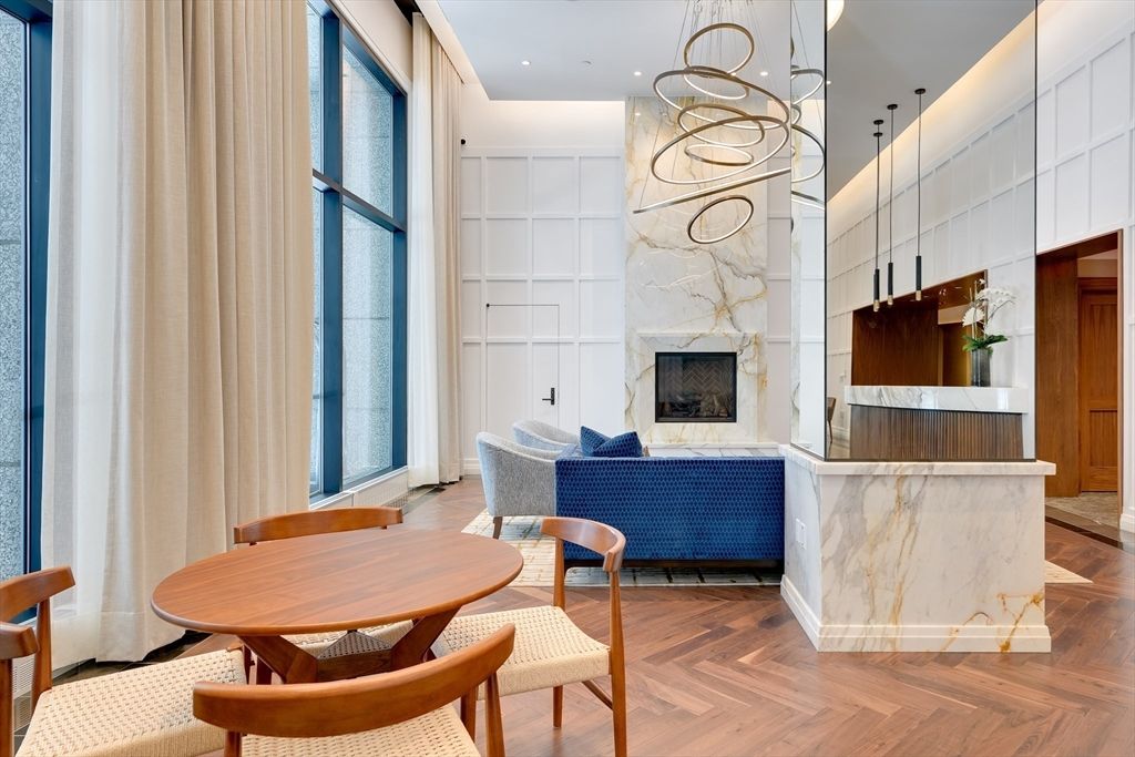 Dining room, Fireplace, Interior, Living room, Pendant Lights, Recessed Lighting, Wood Texture Flooring