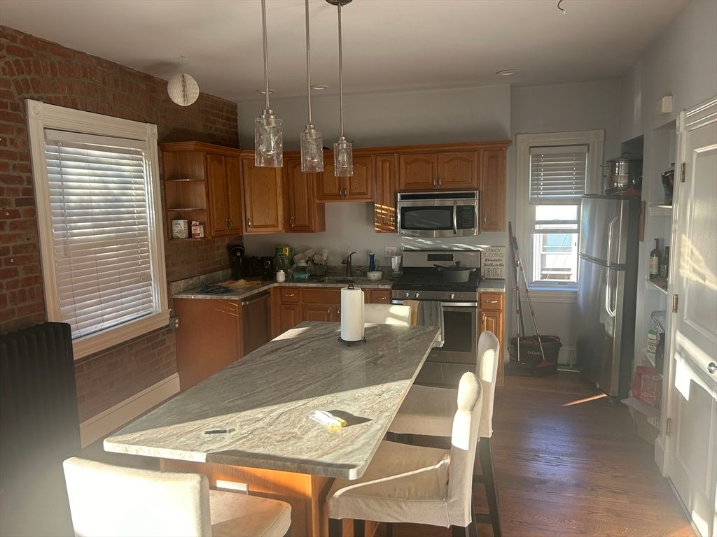 Dining room, Interior, Kitchen, Pendant Lights, Stainless Steel Appliances, Stone Walls, Wood Texture Flooring